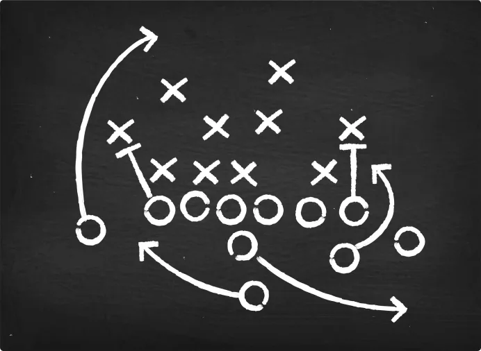 Football play diagram on a chalkboard, representing tactics vs. strategy